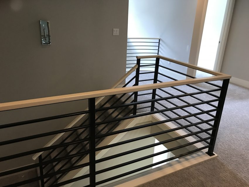 Railing with wood top rail - Custom iRon works